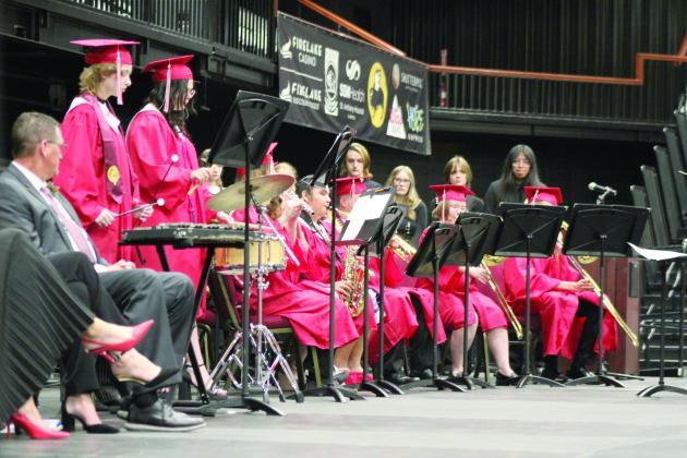 The Senior Band Members play "Slipping Through My Fingers," by ABBA, as arranged by Andrew Schoon, one of the 12 valedictorians at graduation on May 18. Countywide &amp; Sun/Natasha Dunagan
