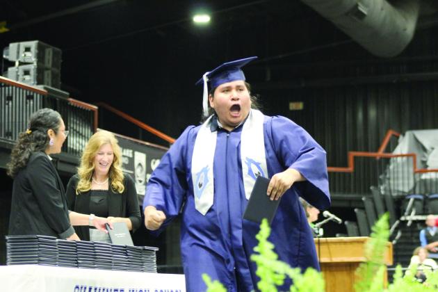 Shawnee Graduate Randall Ketakeah hollers in excitement after receiving his diploma during the 126th Shawnee High School Commencement Ceremony on May 16 at FireLake Arena. Countywide &amp; Sun/Natasha Dunagan