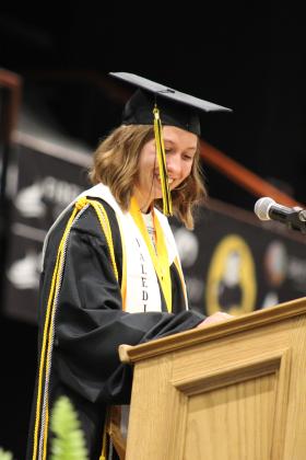 Tecumseh Co-Valedictorian Sarah Miller smiles as she speaks to her fellow graduates. Miller thanked her parents, boyfriend and friends and encouraged everyone to make friends and brighten each other's days. She quoted Patrick Star from Spongebob: "A friend is power. We need that wherever we go." Countywide &amp; Sun/Natasha Dunagan
