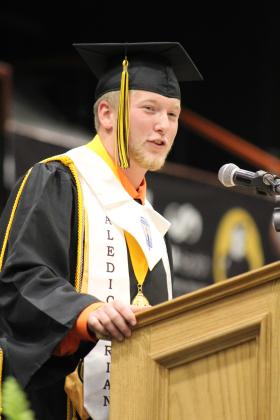Tecumseh Co-Valedictorian Conner Murray addresses the crowd. Murray spoke about finding a purpose and said, "Life can get hard. We all struggle, but remember Jesus loves you this much." Countywide &amp; Sun/Natasha Dunagan