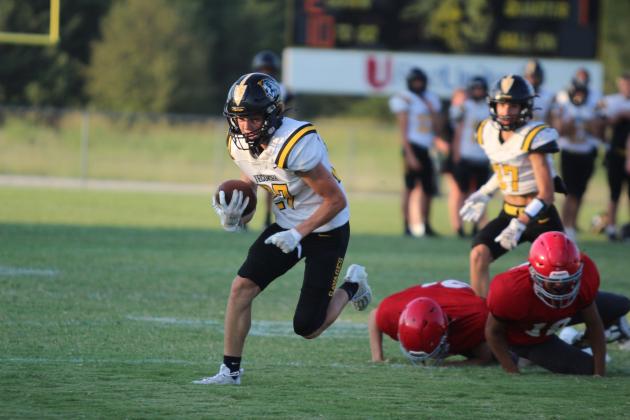 Tecumseh junior A.J. Buttram carries the ball after breaking out of a tackle by two North Rock Creek players, Easton Murray and Jaxon Murray, at the four-team scrimmage, held at Tecumseh High School on Aug. 23. Besides NRC and THS, Bethel and Bridge Creek participated. Their first home game will be against McLoud on Sept. 20 at 7:30 pm, and it will be homecoming. NRC's first game will be Aug.30 at 7 pm against Marlow. Countywide &amp; Sun/Natasha Dunagan