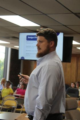 Shawnee Public Schools Director of Finance Tristan Wyatt speaks to the Board of Education about his budget projections for the coming school year during the Aug. 5 regular meeting. Countywide &amp; Sun/Natasha Dunagan