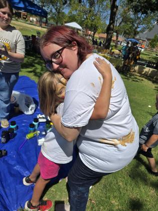 First Annual Hug-A-Thon organizer Emily Streeter shares a "Forever Hug" with her daughter Saige at the event on Aug. 3. Photo provided by Victoria Lee.