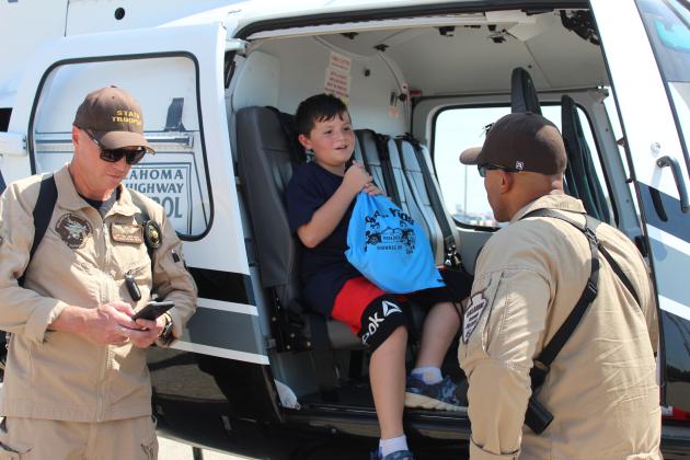Luke Webb talks with a Highway Patrol helicopter pilot.