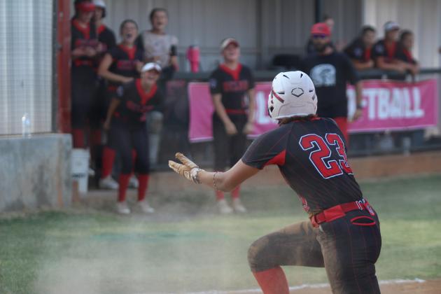 Taycee Lewis celebrates stealing third and home.
