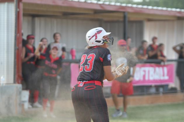Taycee Lewis celebrates stealing third and home.