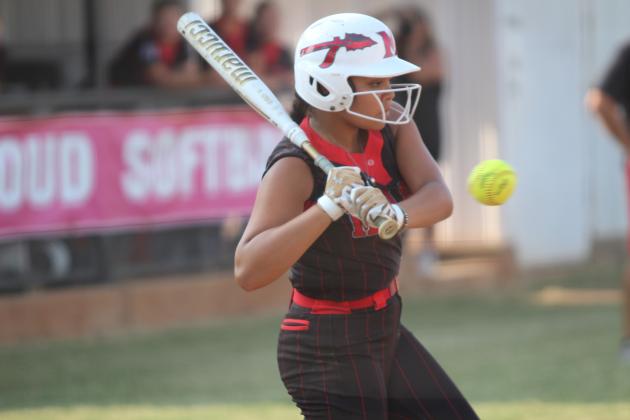 McLoud's Yulisa Jimenez passes on a way-too-close ball before getting to walk during the fourth inning of the home game on Aug. 26. The Lady Redskins won, 13-6. Countywide &amp; Sun/Natasha Dunagan