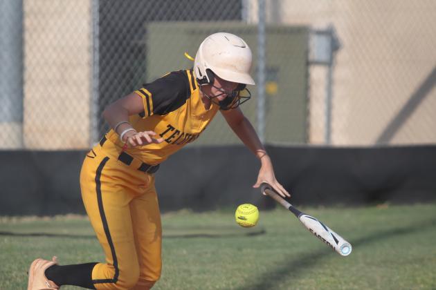 Tecumseh sophomore Madison Gray thows her bat down to run after a hit in the fourth inning of the Aug. 13 game with Cleveland. The Lady Savages won, 10-0. Countywide &amp; Sun/Natasha Dunagan