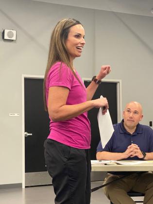 Tecumseh's new athletic director, Casi Bays, presented her new Student-Athlete Handbook to Superintendent Kinsey (seated right) and the school board Monday night.  The new handbook shares info from the regualar handbook as well as OSSAA and NCAA info, links and other resources for parents, students and coaches.  Countywide &amp; Sun/Julie Talton