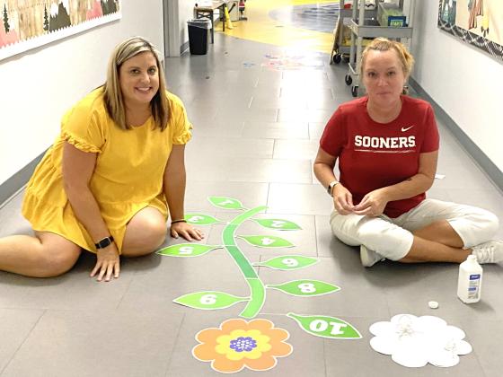 Instructional Coach, Ashley Steward and Librarian/Math Interventionist, Autumn Kinsey work late into the evening  Monday preparing the halls of Tecumseh Early Childhood Center for the incoming students on Thursday.  Countywide &amp; Sun/Julie Talton