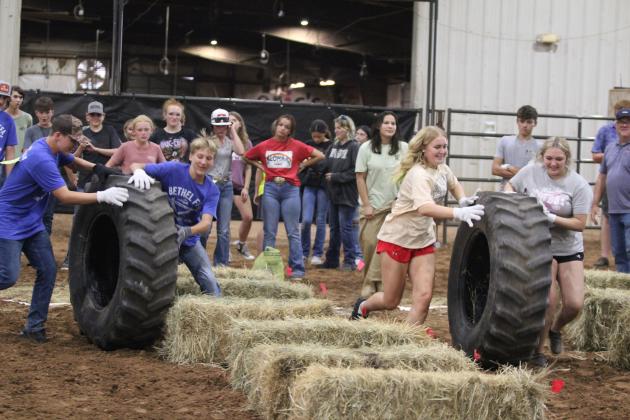 Marshall Owens and Barrett Nunneley, on one Bethel team, and Gracie Little and Hailey Gomez, on the McLoud team, compete in relay races at the 15th Annual Farmhand Olympics during the Pottawatomie County Free Fair on Sept. 4. There were six teams from Bethel FFA, one from McLoud FFA, one from Shawnee FFA and one from North Rock Creek FFA who participated in the relays and individual events, including seed spitting, dummy roping, corn stalk javelin and horseshoes.