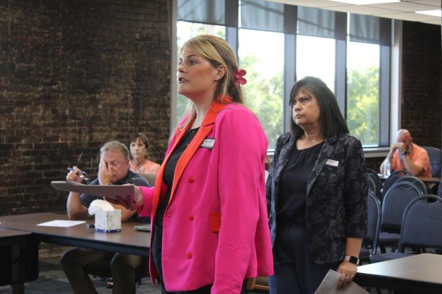 Shawnee Early Childhood Center Assistant Principal Victoria Davenport talks about programs offered at their school, as Principal Karen Watkins listens.