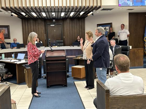 Shawnee City Clerk Lisa Lasyone (left), swears in the new Ward 2 City Commissioner Greta Madson, and new Mayor Eric Stephens. With the recent change to the charter, newly elected officials take office the first meeting after winning an election. Both were also presented with their Certificate of Election. Photo provided by the City of Shawnee