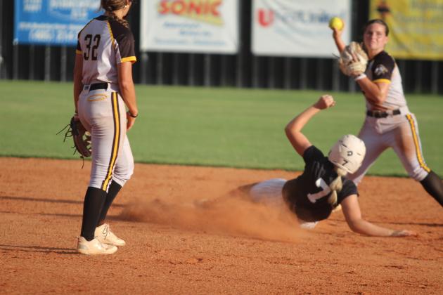 McLoud's Avery Soward slides into second base after Tecumseh's Katie Overstreet already has the catch during the Sept. 19 game at Tecumseh. The Lady Savages won, 5-3. Countywide &amp; Sun/Natasha Dunagan