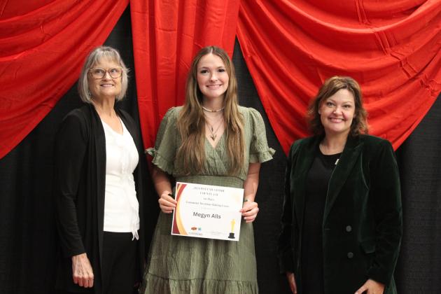 Megyn Alls, center, received the Consumer Decision-Making Essay Contest Award from Kara Robinson, far right, and her mother Eva during the Pottawatomie County 4-H Achievement Banquet on Oct. 21. Countywide &amp; Sun/Natasha Dunagan