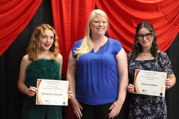 United Way of Eastern Frontier Country CEO Sandy Vanderburg, center, presented two Trip Scholarships to Kimberly Holland, left, and Grace Hobbs during the 4-H Achievement Banquet on Oct. 21. Countywide &amp; Sun/Natasha Dunagan