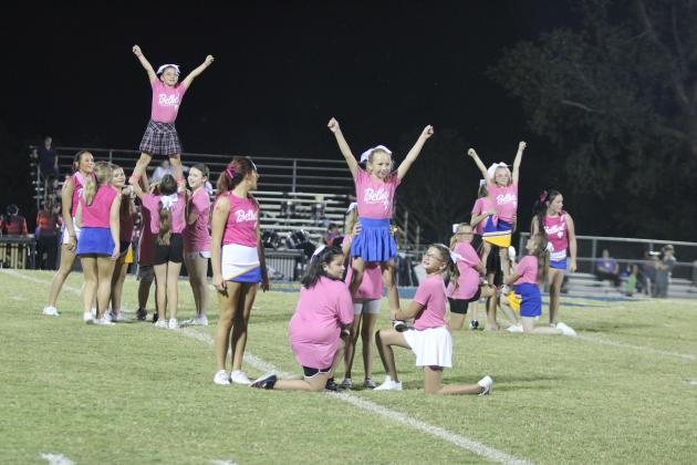 Third- through fifth-grade girls, who went to the Bethel Cheer Clinic last week, form pyramids during halftime of the Oct. 4 Bethel home game. The pre-K through second-grade group, led by the Bethel High School Cheerleaders, also performed that night. Countywide &amp; Sun/Natasha Dunagan