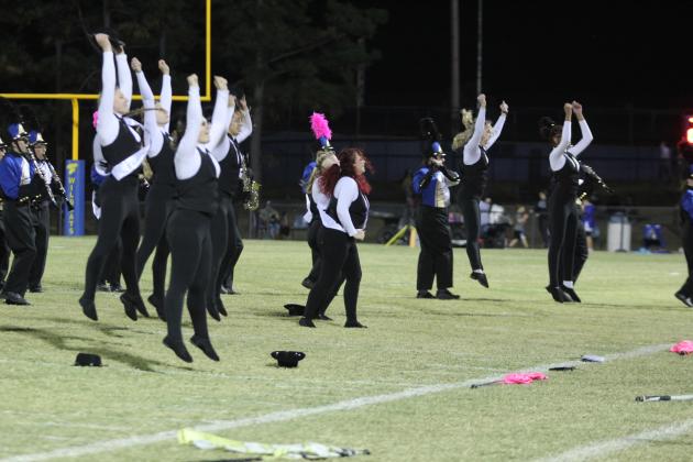 The Bethel Color Guard dance to "Soul Man" during the Pride of Bethel halftime performance on Oct. 25. It was both Senior Night and Pink Out for the district home game. Countywide &amp; Sun/Natasha Dunagan