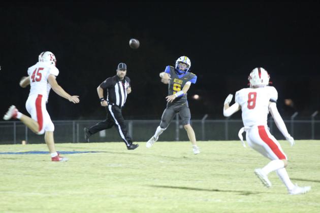 Bethel sophomore Maddox Davis passes to junior Luke Quinter in the first quarter of the Oct. 25 district home game. The Wildcats lost, 20-30. Countywide &amp; Sun/Natasha Dunagan