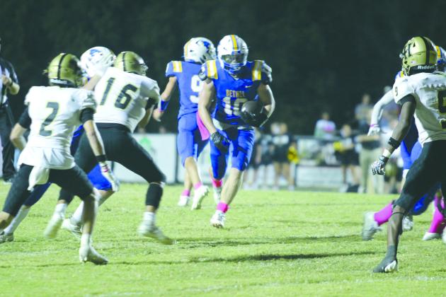 Bethel junior Luke Quinter finds a path through the Hugo defense on his way to a touchdown at the Oct. 4 Bethel "Pink Out" home game. The Wildcats lost, 24-38. Countywide &amp; Sun/Natasha Dunagan