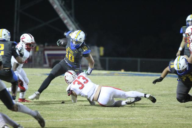 Bethel junior Luke Quinter sidesteps a Kiefer defender in the first quarter of the Oct. 25 district home game. The Wildcats lost, 20-30. Countywide &amp; Sun/Natasha Dunagan