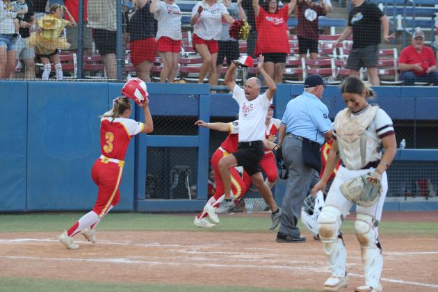 Dale Head Fast-Pitch Coach Andy Powell jumps for joy as Breeze Higdon (#3) crosses home plate in the seventh inning of the OSSAA Class 2A Fast-Pitch Softball State Championship against Pocola, held at Devon Park (formerly USA Softball Hall of Fame Stadium) on Oct. 12. Higdon was a relief runner for Kaylyn Solis, and this was the one run of the game, which earned the Lady Pirates the victory. Countywide &amp; Sun/Natasha Dunagan