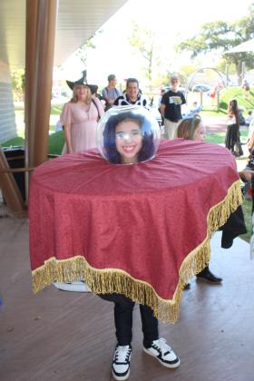 Aubrey Grubbs, 9, of Shawnee, tied for first place for her crystal ball costume in the 6-15 Costume Contest during the Enchanted Woodland event, held at Woodland Veterans Park in Shawnee on Oct. 26. Shawnee Director of Tourism Stacy Cramer Moore estimates there were about 40 entries each for the two age divisions of the costume contest. Moore said she suggested to the organizations and businesses who had booths to bring 500 pieces of candy and most ran out. Countywide &amp; Sun/Natasha Dunagan