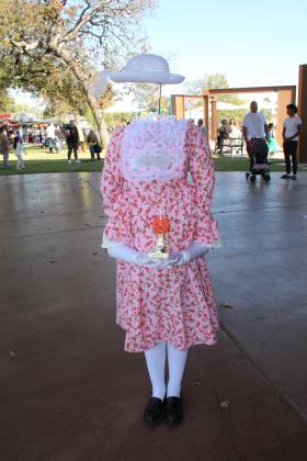 Giselle Acosta-Barnett, 7, of Shawnee, tied for first place for her "Invisible Girl" costume in the 6-15 Costume Contest during the Enchanted Woodland event, held at Woodland Veterans Park in Shawnee on Oct. 26. Shawnee Director of Tourism Stacy Cramer Moore estimates there were about 40 entries each for the two age divisions of the costume contest. Moore said she suggested to the organizations and businesses who had booths to bring 500 pieces of candy and most ran out. Countywide &amp; Sun/Natasha Dunagan