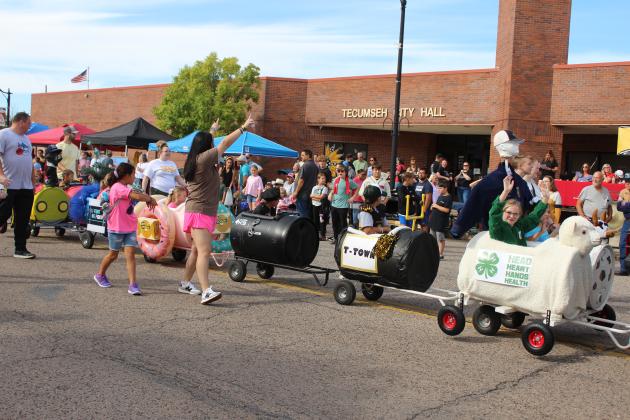 The Tecumseh Pentecostal Church of God barrel train, with cars representing organizations and businesses in Tecumseh, is pulled in the Frontier Days Parade on Sept. 28. They won first overall and first in the youth organization category. Countywide &amp; Sun/Natasha Dunagan