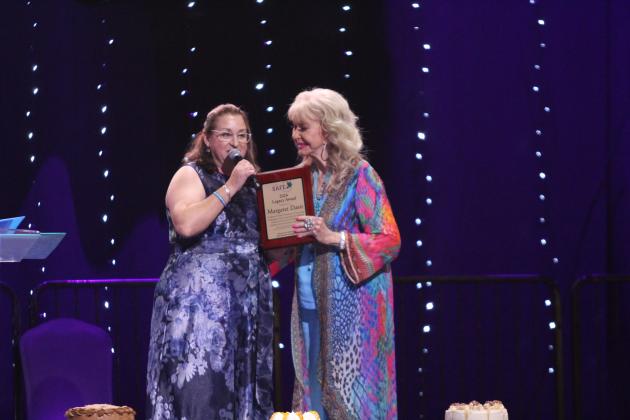 Renee Clemmons presents the Legacy Award to Margaret Davis.