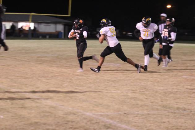 Maud sophomore Ryan Poull gains yardage on a play before making a touchdown in the next play against Midway on Oct. 17. The Tigers won, 50-0. Countywide &amp; Sun/Natasha Dunagan