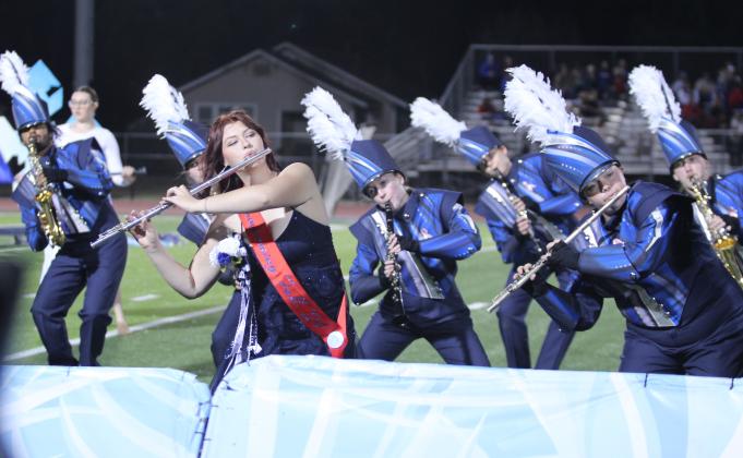 Members of the Pride of the Pack perform their "Snow" show at halftime of the homecoming game, Oct. 18. They include, from left, Kadence Davis, Claudia Thomason (partly hidden), Isabella Neely, Emelia Bronson, Piper McCune, Corie Jepsen and Steven Porter. Neely, as well as Evelyn Miner and Jaiden Evans, represented band as homecoming candidates. Countywide &amp; Sun/Natasha Dunagan