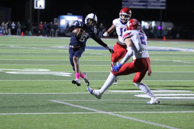 Shawnee junior Zyron Campbell runs with the quarterback keeper and dodges Durant's defense during the first quarter of the homecoming game with Durant on Oct. 18. The Wolves won, 28-7. Countywide &amp; Sun/Natasha Dunagan