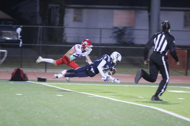 Shawnee sophomore Rahmel Slaughter-bey dives for a pass during the first quarter of the homecoming game with Durant on Oct. 18. The Wolves won, 28-7. Countywide &amp; Sun/Natasha Dunagan