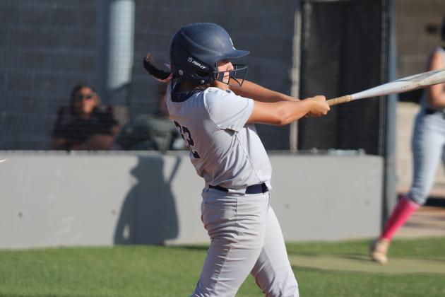 Shawnee pitcher Nana Martin hits a double in the second inning of the home game with Seminole on Oct. 1. Martin also hit a double in the first inning and a single in the third inning. The Lady Wolves Fast-Pitch team won, 12-0. Countywide &amp;  Sun/Natasha Dunagan