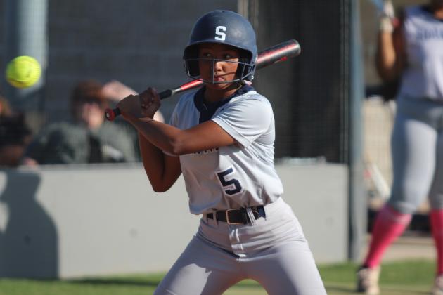 Shawnee’s Amiyah Briones keeps her eye on the ball before hitting a single in the second inning of the home game with Seminole on Oct. 1. The Lady Wolves Fast-Pitch team won, 12-0. Countywide &amp; Sun/Natasha Dunagan