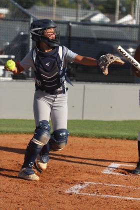 Shawnee catcher Zaleeigh Prater throws back to the pitcher in the home game with Seminole on Oct. 1. The Lady Wolves Fast-Pitch team won, 12-0. Countywide &amp;  Sun/Natasha Dunagan