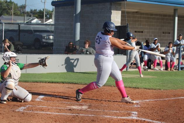 Shawnee's Karma Mason hits a single in the third inning of the home game with Seminole on Oct. 1. The Lady Wolves Fast-Pitch team won, 12-0. Countywide &amp;  Sun/Natasha Dunagan
