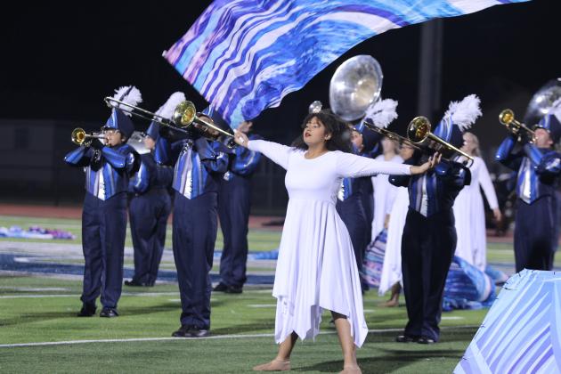 Shawnee Color Guard member Caitlin Alderson and the Pride of the Pack Marching Band perform a show themed "Snow" at halftime of the home game on Sept. 27. Countywide &amp; Sun/Natasha Dunagan