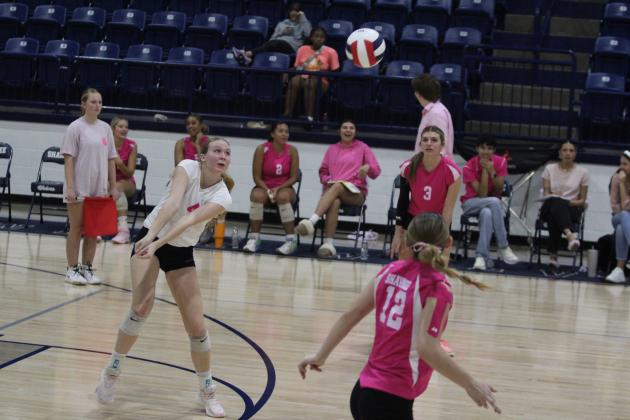 Shawnee libero Kylee Moore prepares to keep the ball in play during the home volleyball match with Guthrie on Pink Out Night, Oct. 1. The Lady Wolves won all three games: 25-13, 25-10, and 25-7. Countywide &amp; Sun/Natasha Dunagan