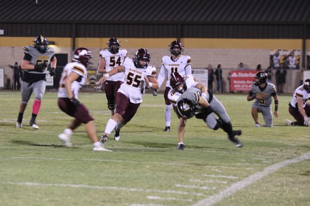 Tecumseh senior Darian Clark gains some yardage before being tackled in the second quarter of the Oct. 10 home game with Blanchard. The Savages lost, 7-34. Countywide &amp; Sun/Natasha Dunagan