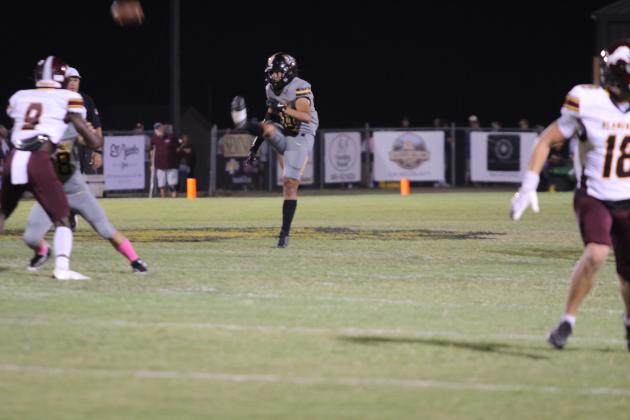Tecumseh freshman Jackson Douglas punts the ball during the second quarter of the Oct. 10 home game against Blanchard. The Savages lost, 7-34. Countywide &amp; Sun/Natasha Dunagan