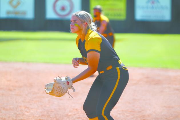 Tecumseh senior Alyssa Norton watches the batter from first base in the Oct. 3 game with Stilwell.