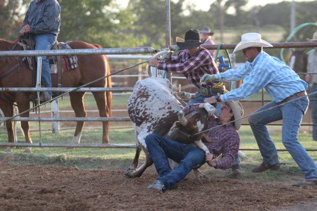 Three members of the Levi Ranch team participate in the Muggin division of the Tecumseh Round-Up Club Rodeo on Sept. 28 after the Frontier Days festival. Five other ranches or cattle companies also competed in roping events at the rodeo. Countywide &amp; Sun/Natasha Dunagan
