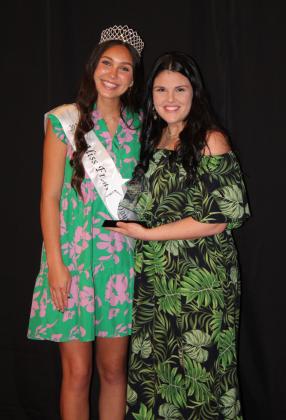 Katie McMahan, of Athletico, accepts the Rising Star Award from Miss Frontier Days Jalee Meyers. McMahan was also named Business Person of the Year.