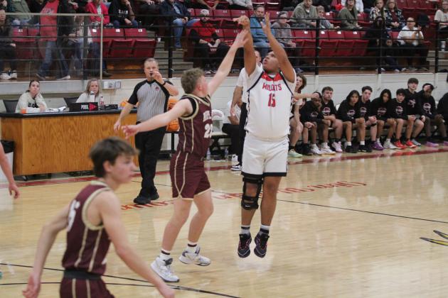 Earlsboro's Quintin Lena drops three points in the second quarter of the Nov. 19 home game against Ripley. Countywide &amp; Sun/Natasha Dunagan