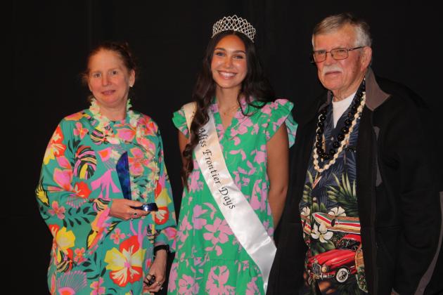 Kacy Kinsey, far left, and Tecumseh Mayor Eddy Parker, both of AECO Sales and Service, receive the Legacy Award from Miss Frontier Days Jalee Meyers. Countywide &amp; Sun/Natasha Dunagan