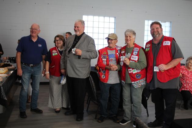 Rev. Jonker hands out patches to the Church Mobilization RV Volunteer group.