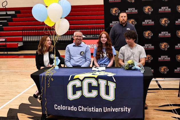 North Rock Creek's Jannah Shoffner signed with Colorado Christian University to play soccer.  Watching her are her parents Joshua &amp; Suzanne and boyfriend Ethan Nowakowski along with AD Evan Smith. Photo courtesy of Gowin Photography