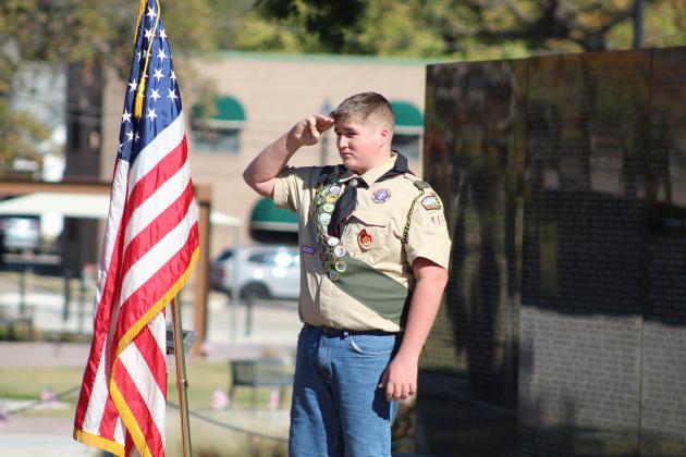 Robby Byrd, of Scout Troop 417, salutes after presenting the colors during the Pottawatomie County Veterans Memorial and Museum Veterans Day Program, held at the Woodland Veterans Park on Nov. 11. Countywide &amp; Sun/Natasha Dunagan